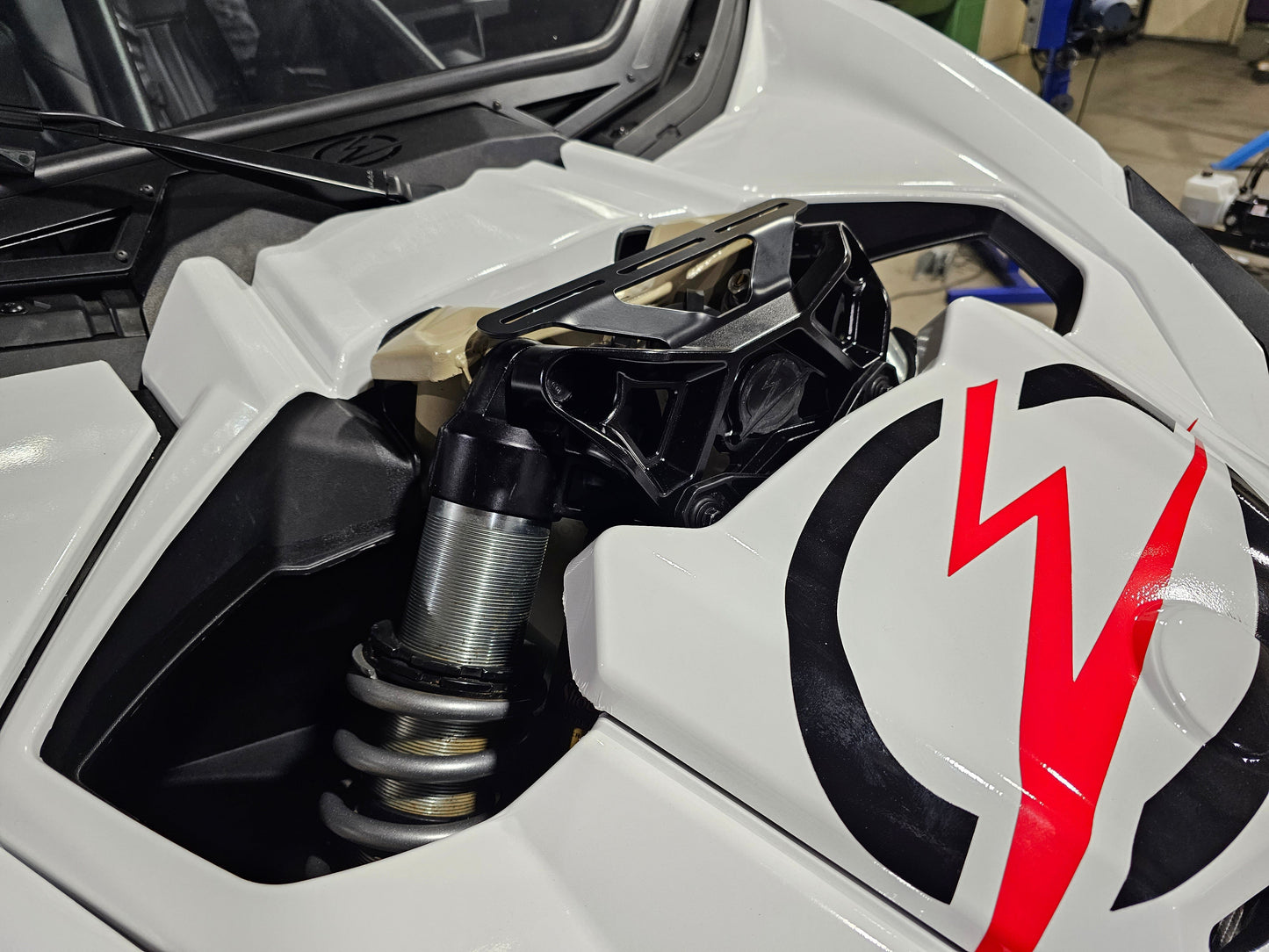 https://cdn.shopify.com/s/files/1/0749/1980/5228/files/2017_Can_Am_X3_Upper_Shock_Brace_Light_Mount_11.jpg?v=1721075710