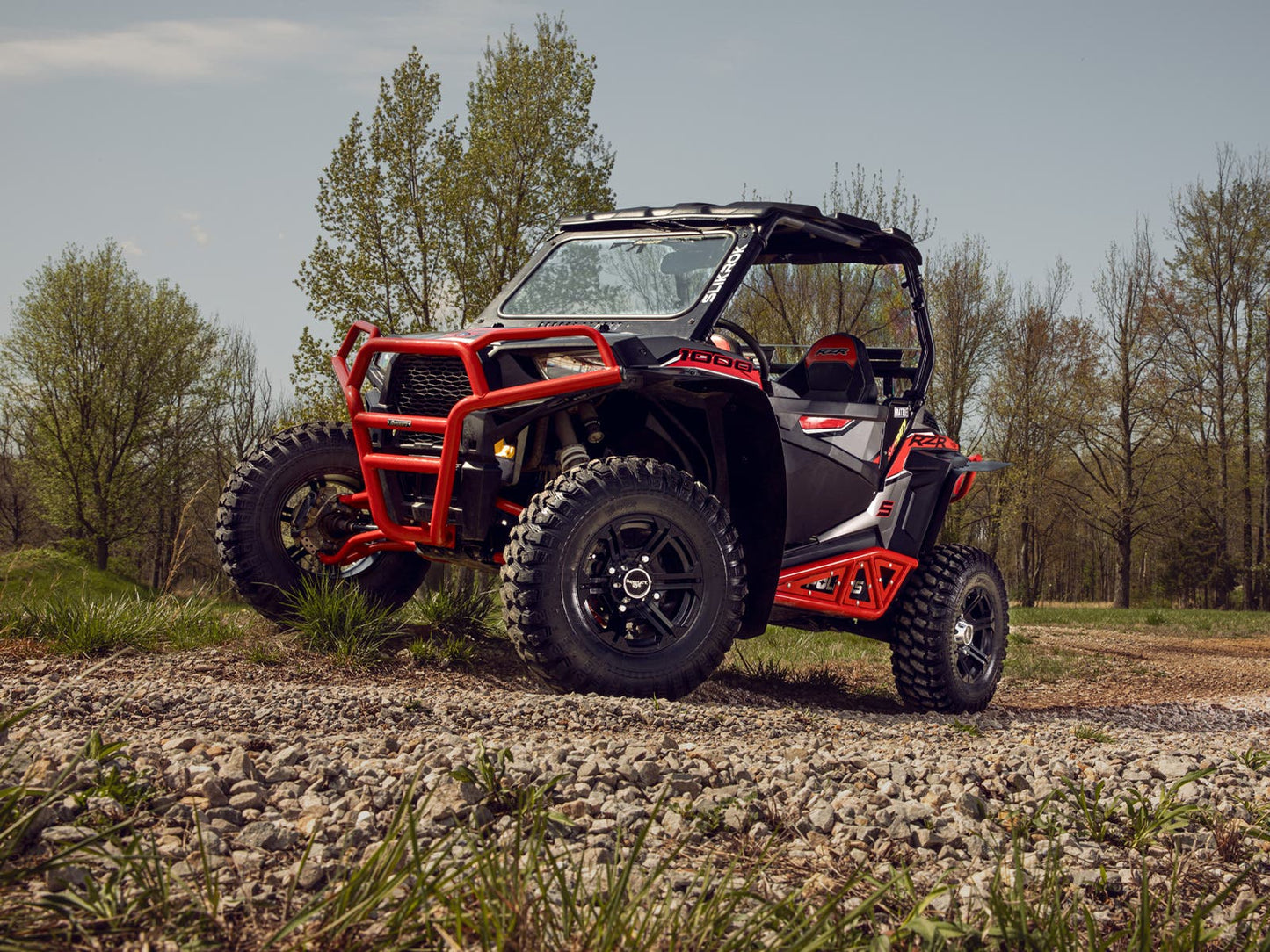 https://media.superatv.com/media/catalog/product/p/o/polaris_rzr_1000_s_heavy_duty_rock_sliders_red_3_2.jpg